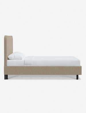Side view of Clementine buff boucle platform bed with undulating lined headboard