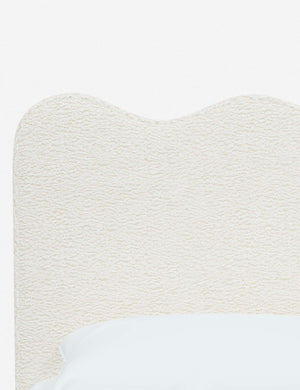Close-up of the undulating lines on the headboard of the Clementine cream sherpa platform bed