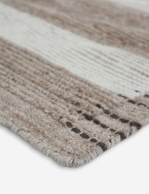 Close-up of the corner of the Abode geometric two-toned kand-knotted floor rug by Élan Byrd