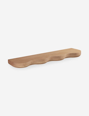 Cario sculptural wavy edge oak wall shelf.