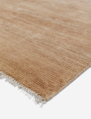 Fringed corner of the heritage wheat rug