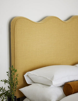 Close-up of the golden linen fabric on the Clementine platform bed