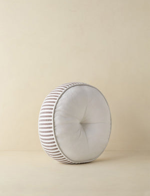 Angled view of the Littu Indoor / Outdoor Striped Disc Pillow by Sarah Sherman Samuel in Brown