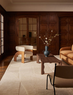 Tosca beaded detailed loop handle ceramic vase by Aimee Song styled on a coffee table in a living room