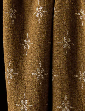 Close up of the Fania lightweight linen-cotton blend floral motif throw.