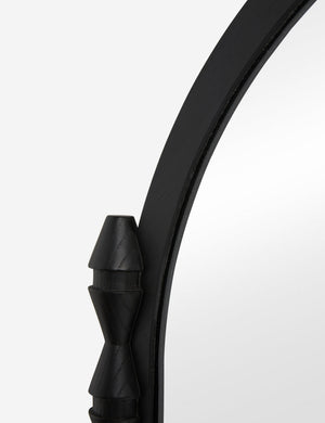 Close up of the Topia arched carved wood mantel mirror by Ginny Macdonald in black.