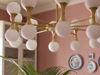 | Video of the Abernathy gold wheel-like chandelier with dual-light fixtures