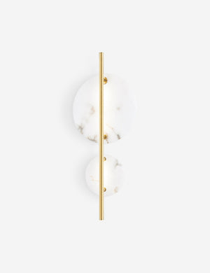Angled view of the Eleir sconce with alabaster discs and antique brass finish