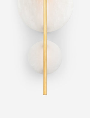 Close-up of the lower half of the Eleir sconce with alabaster discs and antique brass finish