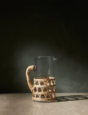 Shelly glass pitcher with natural seagrass accent