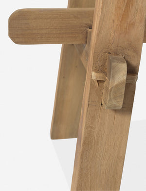 Close-up of the leg joinery detailing of the Arlene craftsman-style antiqued teak wood bench