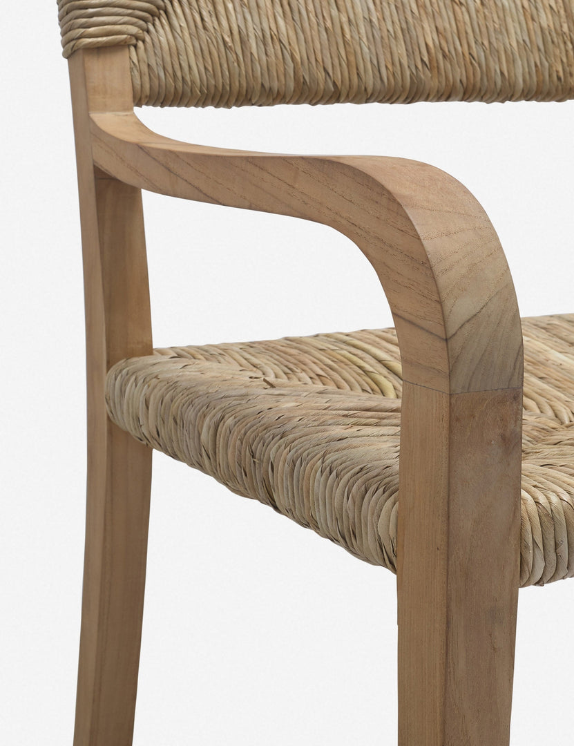 | Angled close-up of the arm and seat on the Nolani woven rattan arm chair