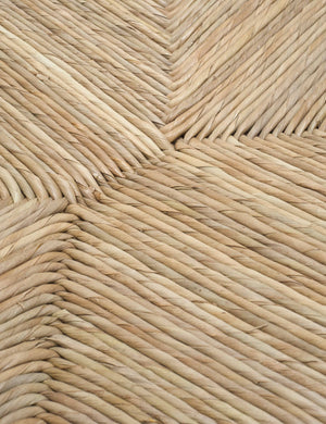 Detailed shot of the woven rattan material on the Nolani arm chair